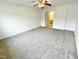 Bright bedroom featuring carpet, ceiling fan and access to bathroom at 311 Gladstone Dr, Durham, NC 27703