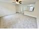 Living room with carpet, ceiling fan and kitchen view at 311 Gladstone Dr, Durham, NC 27703