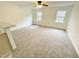 Spacious living room with neutral carpeting and ceiling fan at 311 Gladstone Dr, Durham, NC 27703