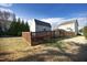 Backyard view of shed and wooden fence at 36 Aster Ln, Pittsboro, NC 27312