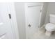 Small bathroom with toilet and access to storage at 36 Aster Ln, Pittsboro, NC 27312