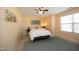 Bright bedroom with a queen bed and ceiling fan at 36 Aster Ln, Pittsboro, NC 27312
