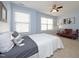 Bedroom with queen bed, ceiling fan and sitting area at 36 Aster Ln, Pittsboro, NC 27312
