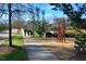 Peaceful community walkway with pond and sculpture at 36 Aster Ln, Pittsboro, NC 27312