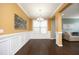 Dining area with hardwood floors and mustard yellow walls at 36 Aster Ln, Pittsboro, NC 27312