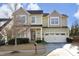 Two-story house with a neutral color scheme and attached garage at 36 Aster Ln, Pittsboro, NC 27312