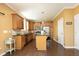 Spacious kitchen with island, stainless steel appliances, and dark wood cabinets at 36 Aster Ln, Pittsboro, NC 27312