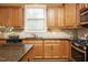 Modern kitchen with granite countertops and light wood cabinets at 36 Aster Ln, Pittsboro, NC 27312
