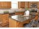 Kitchen island with granite countertop and stainless steel appliances at 36 Aster Ln, Pittsboro, NC 27312