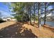 Peaceful lakefront view with mature trees at 36 Aster Ln, Pittsboro, NC 27312