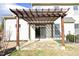 Back patio with pergola and tiled flooring at 36 Aster Ln, Pittsboro, NC 27312