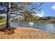 Serene pond with fountain and lush greenery at 36 Aster Ln, Pittsboro, NC 27312