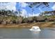 Community pond with central fountain feature at 36 Aster Ln, Pittsboro, NC 27312