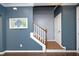 Elegant staircase with white railing and dark hardwood treads at 36 Aster Ln, Pittsboro, NC 27312