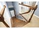 Elegant staircase with wooden steps and white railings at 36 Aster Ln, Pittsboro, NC 27312