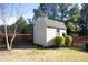 Light-grey storage shed in backyard setting at 36 Aster Ln, Pittsboro, NC 27312