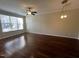 Spacious living room featuring hardwood floors and ample natural light at 5742 Corbon Crest Ln, Raleigh, NC 27612