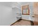 Bright pantry with white shelving and wood trim at 578 Marler Rd, Benson, NC 27504