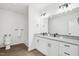 Bathroom with a double sink vanity, granite countertops, and new fixtures at 825 Graham St, Burlington, NC 27217