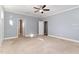 Bright bedroom with neutral carpet and an ensuite bathroom at 102 Mallory Ct, Clayton, NC 27520