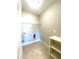 Laundry room with built in shelving and overhead storage at 102 Mallory Ct, Clayton, NC 27520