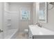 Bathroom with bathtub, vanity, and mirror at 103 Park Dr, Oxford, NC 27565