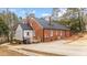 Brick house exterior with a large driveway and mature trees at 103 Park Dr, Oxford, NC 27565