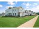 Attractive townhome community with manicured lawns and sidewalks at 103 Siebold St, Garner, NC 27529