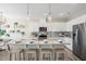 Modern kitchen island with granite countertops, stainless steel appliances, and stylish pendant lighting at 103 Siebold St, Garner, NC 27529