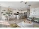 Open living space featuring a modern kitchen with an island and a dining area with stylish seating at 103 Siebold St, Garner, NC 27529