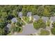 An aerial view showing the charming two-story home nestled on a cul-de-sac with lush landscaping at 106 Dairy Ct, Chapel Hill, NC 27516
