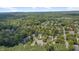 An aerial view showing the lush community, with beautiful tree coverage surrounding well-maintained homes at 106 Dairy Ct, Chapel Hill, NC 27516