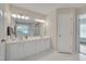 Bright bathroom features double vanity, large mirror, and good lighting at 106 Dairy Ct, Chapel Hill, NC 27516