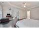 Bright and spacious bedroom with French doors, television and seating area at 106 Dairy Ct, Chapel Hill, NC 27516