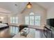 Large bedroom with vaulted ceiling, recessed lighting, and ample natural light at 106 Dairy Ct, Chapel Hill, NC 27516