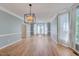 Spacious dining room with hardwood floors and stylish light fixture at 106 Dairy Ct, Chapel Hill, NC 27516