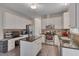 Beautiful kitchen featuring white cabinets, stainless steel appliances, an island, and desk at 106 Dairy Ct, Chapel Hill, NC 27516