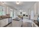 Kitchen with white cabinets, stainless steel appliances, granite counters, and open floor plan at 106 Dairy Ct, Chapel Hill, NC 27516