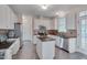Well-lit kitchen featuring white cabinets, stainless steel appliances, granite countertops, and stainless steel appliances at 106 Dairy Ct, Chapel Hill, NC 27516