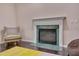 Cozy living room with fireplace and plush armchair seating at 106 Dairy Ct, Chapel Hill, NC 27516