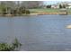 Scenic pond with a gazebo and dock, offering a peaceful waterside retreat at 106 Dairy Ct, Chapel Hill, NC 27516