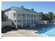 Community pool house with covered porch and ample seating, perfect for gatherings at 106 Dairy Ct, Chapel Hill, NC 27516