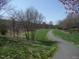 Picturesque community walking trail winding through lush greenery and open spaces at 106 Dairy Ct, Chapel Hill, NC 27516