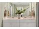 Double vanity bathroom with beige countertops and green walls at 108 Kobus Ct, Garner, NC 27529