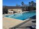 Refreshing community swimming pool with adjacent seating and shaded area at 109 Cabana Dr, Apex, NC 27539