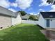Spacious fenced backyard with lush green lawn and views of neighboring homes at 110 Ethans Glenn Ct, Cary, NC 27513