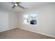 Bright bedroom with neutral carpeting and large windows at 110 Ethans Glenn Ct, Cary, NC 27513