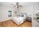Bright bedroom with hardwood floors, ceiling fan, and plenty of natural light at 110 Ethans Glenn Ct, Cary, NC 27513
