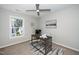 Spacious bedroom with desk, window, and ceiling fan at 110 Ethans Glenn Ct, Cary, NC 27513