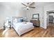 Spacious bedroom with hardwood floors, ceiling fan, and neutral color palette at 110 Ethans Glenn Ct, Cary, NC 27513